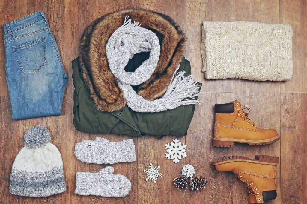 Winter wardrobe laid out for packing
