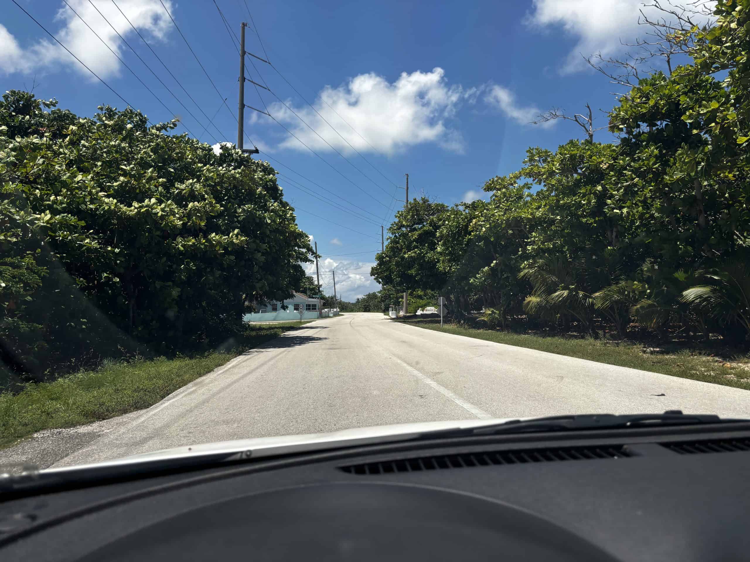 A photo of a local road from a vehicle driving in Grand Cayman.