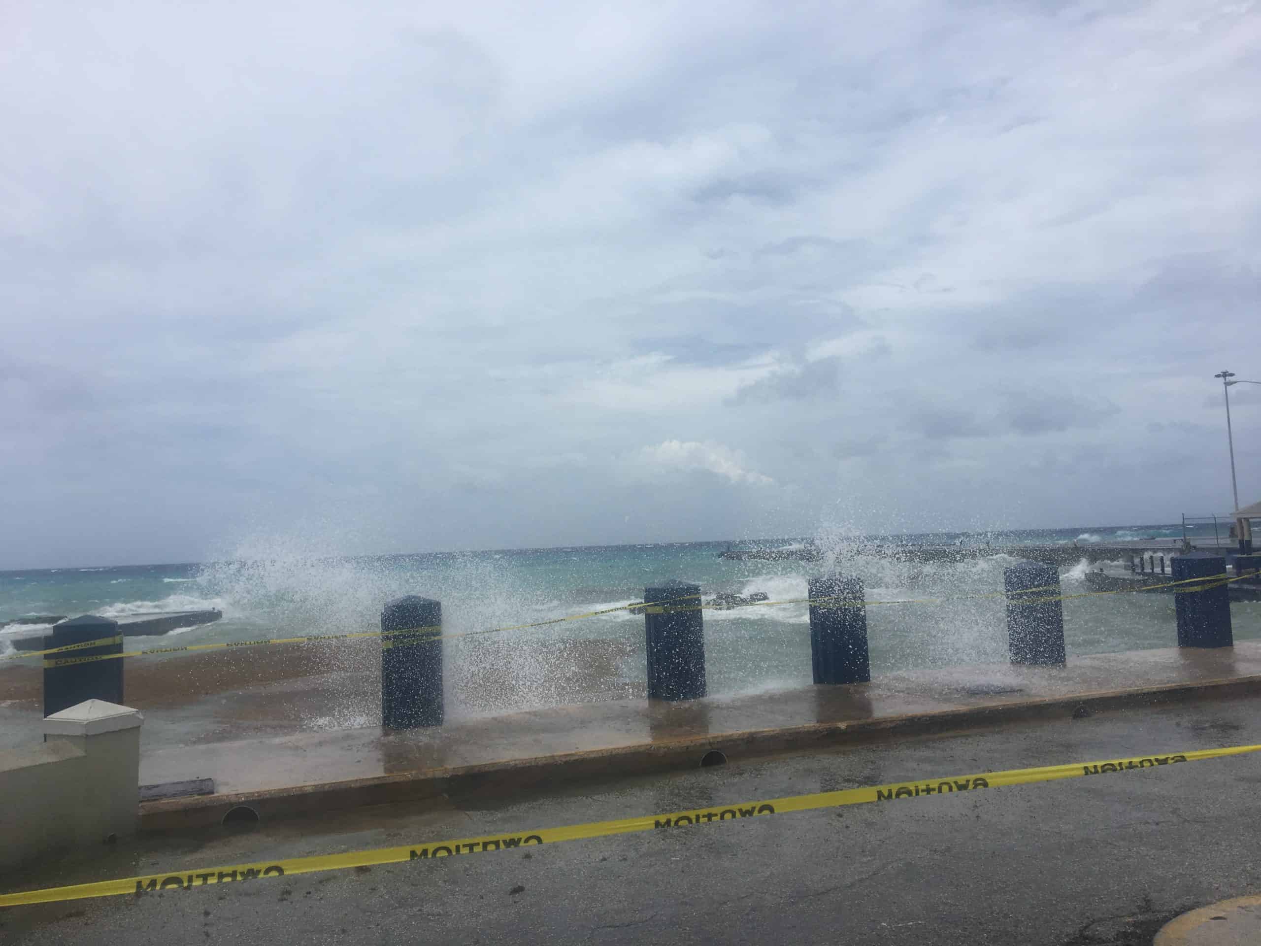 Large waves coming over the road during a storm in George Town Grand Cayman
