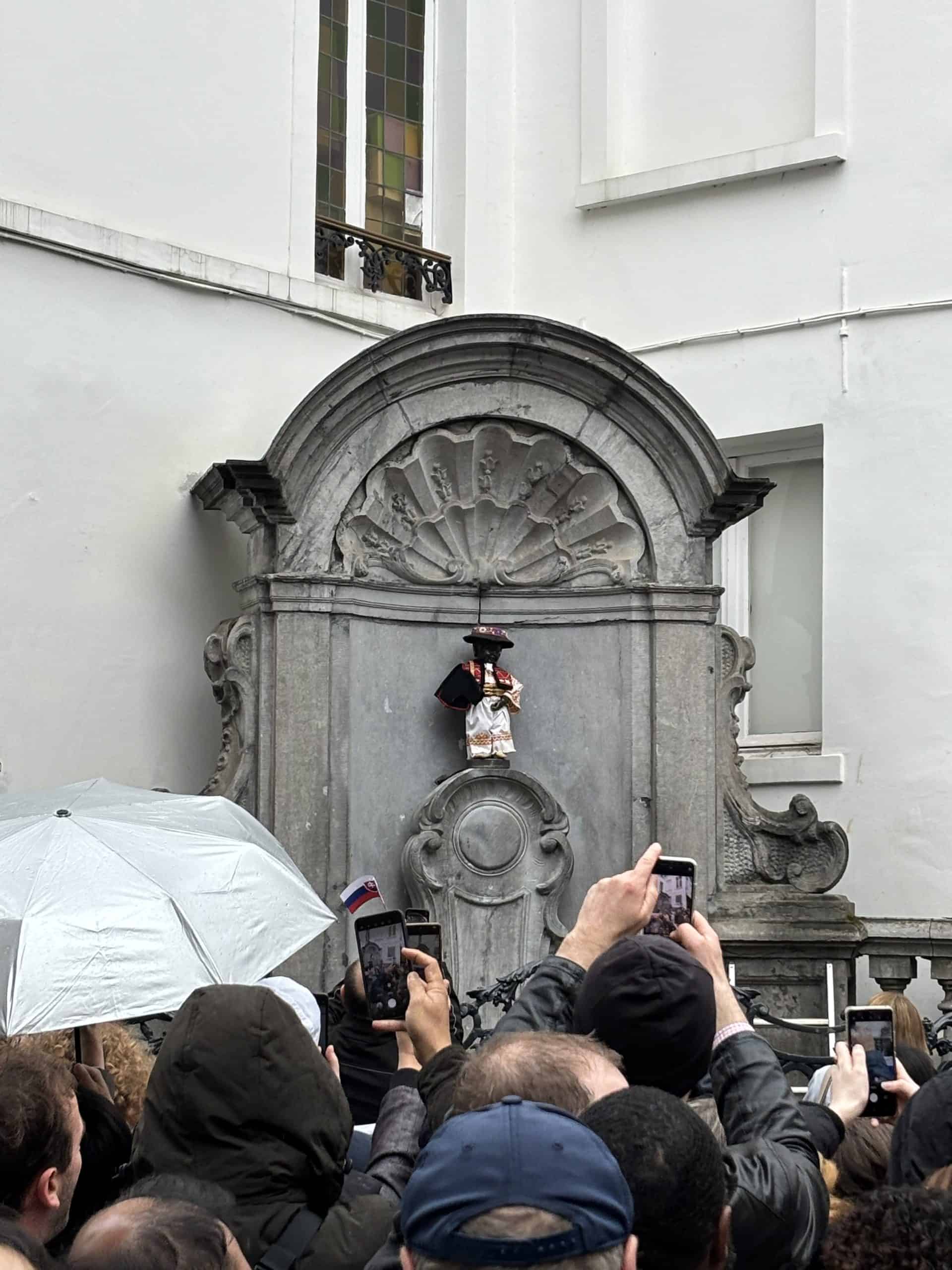 The statue Manneken Pis dressed in a bull fighter's costume.