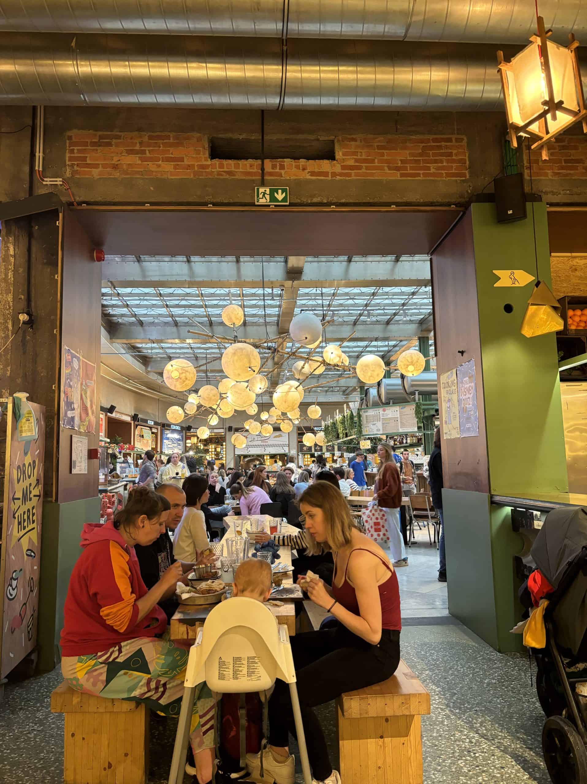 People enjoying their food at Wolf Shared Food Market in Brussels