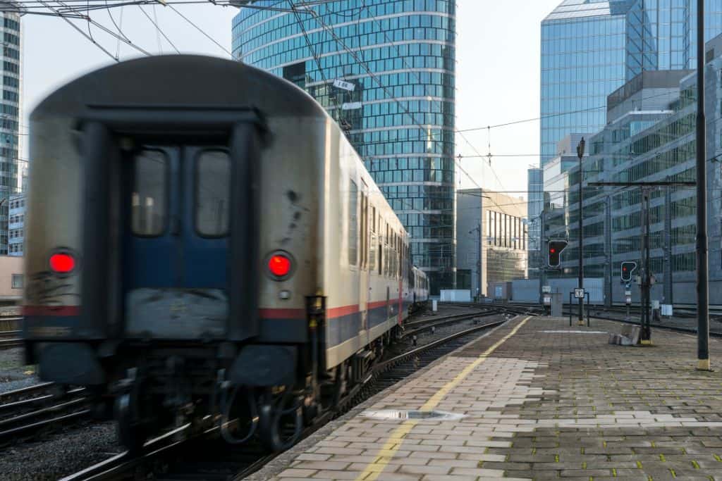 A train departing from a station in Brussels.