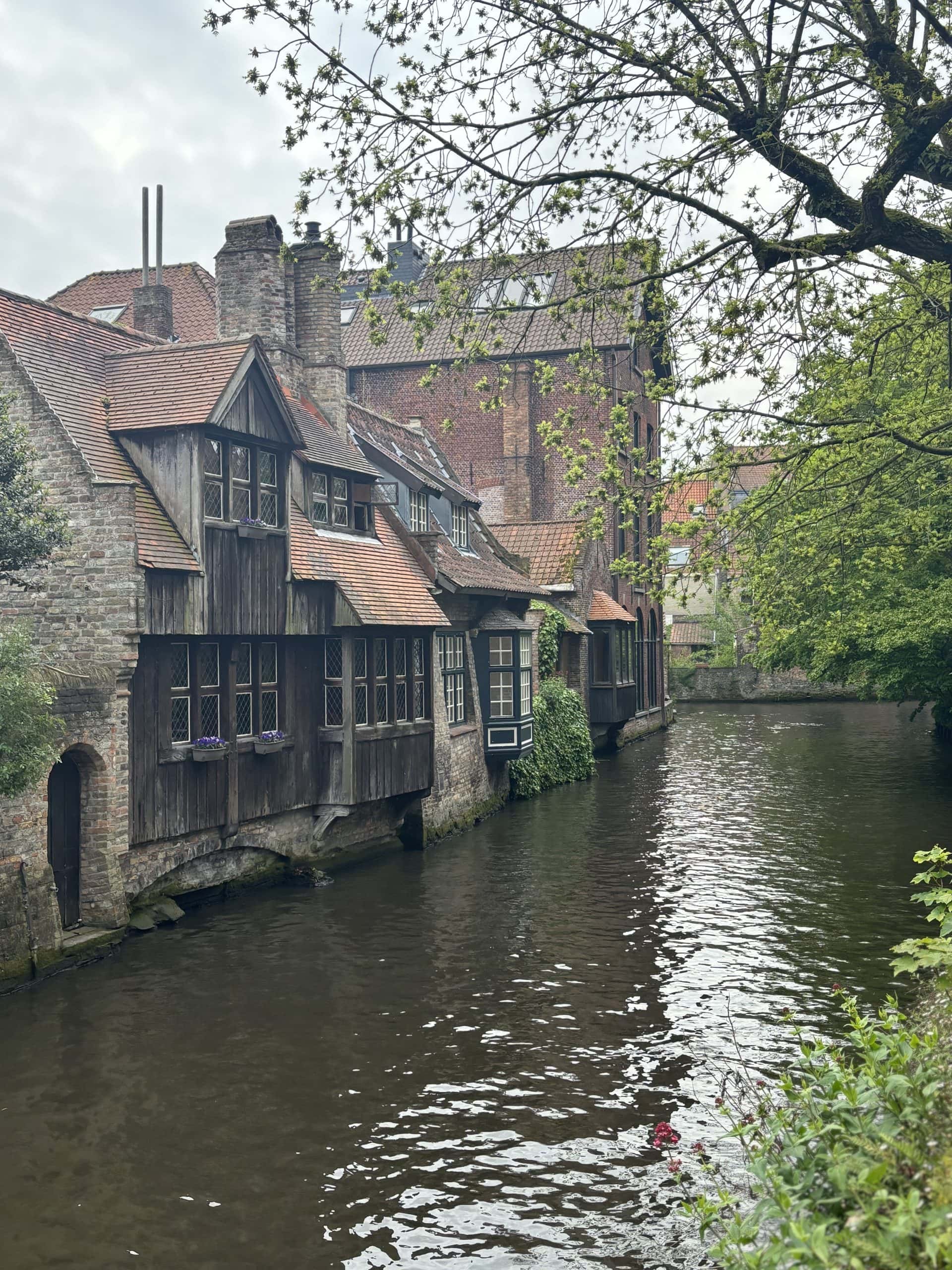 Old building along a canal in Bruges, Belgium